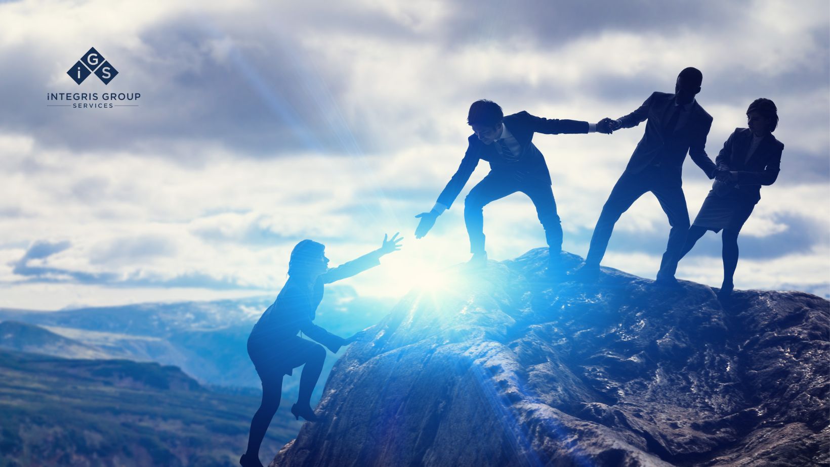 Business professionals helping each other climb a rocky mountain, symbolizing teamwork, resilience, and a people-first leadership approach.