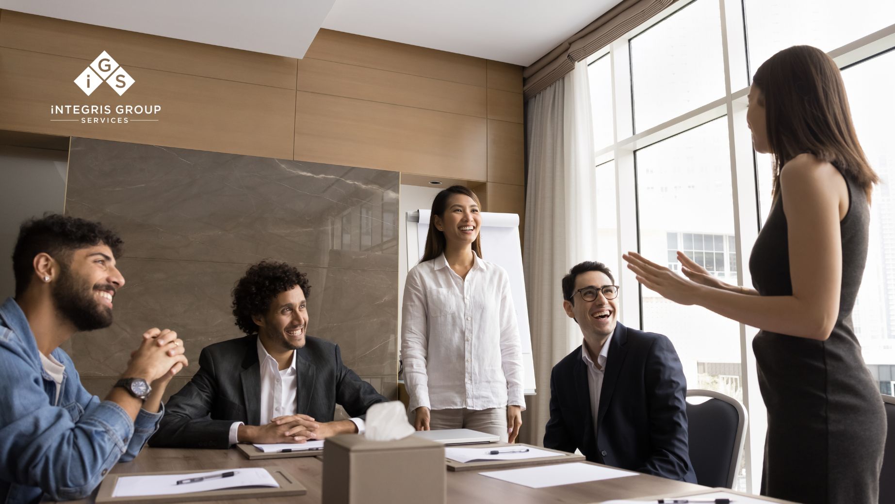 Group of diverse professionals engaged in a collaborative meeting, representing the importance of fostering psychological safety and value-aligned relationships in the workplace.