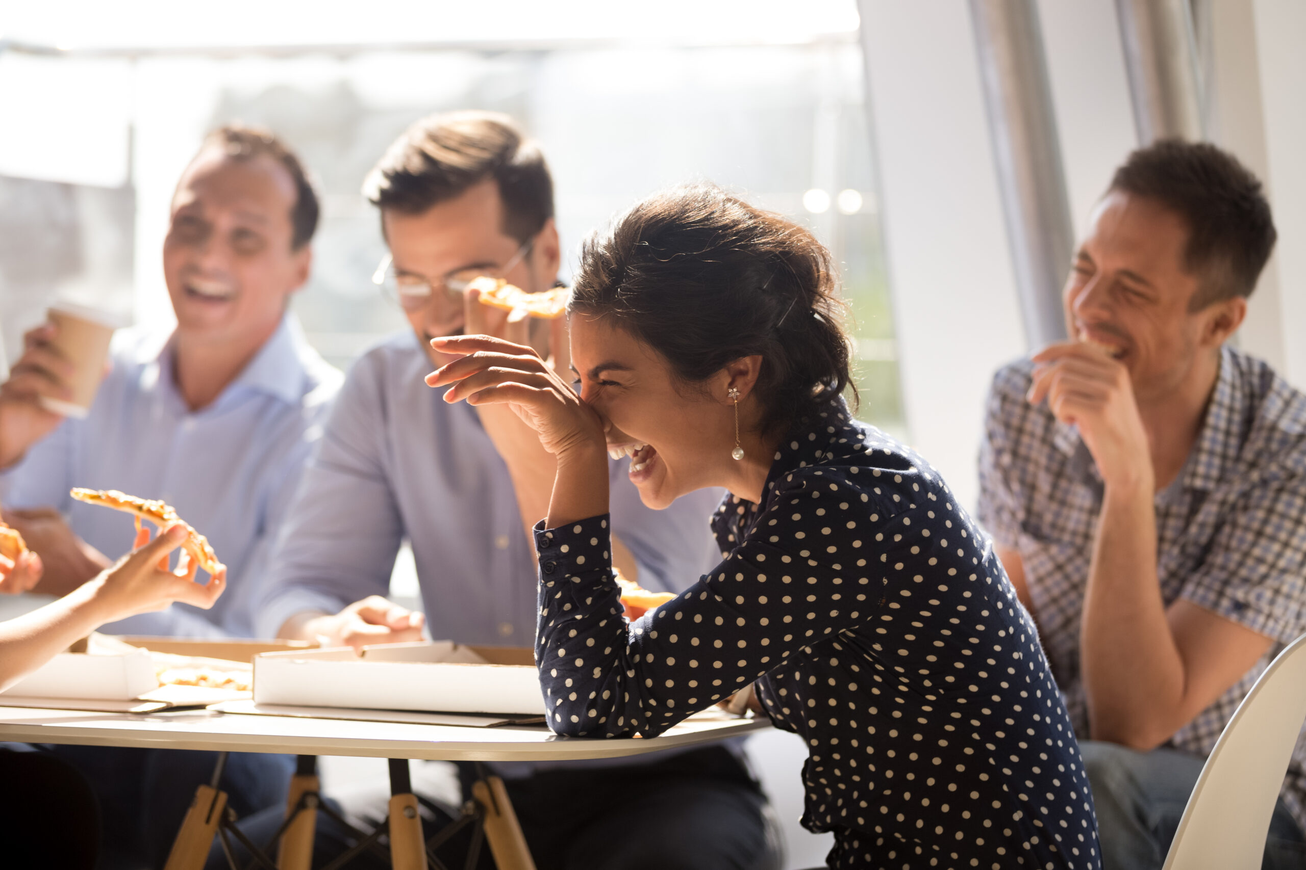 Team enjoying a relaxed moment together, symbolizing the benefits of work-life balance in leadership.