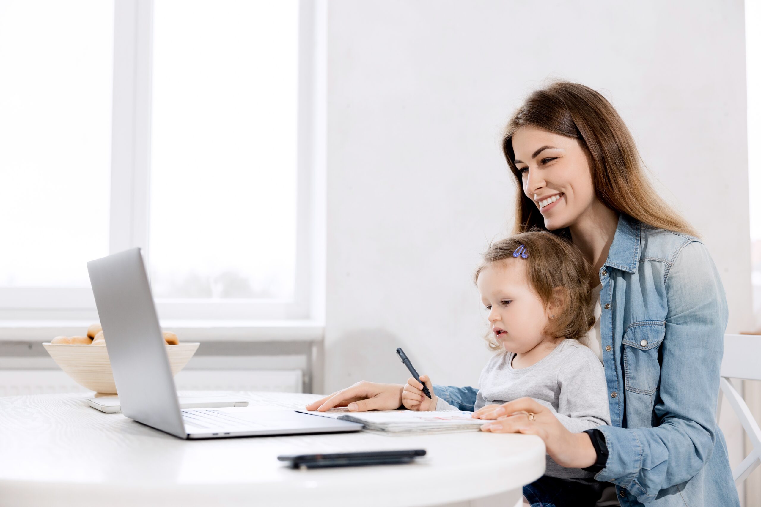 Parent working from home, balancing leadership and family life.